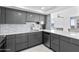 Modern kitchen featuring stainless steel appliances, sleek cabinetry, and tiled backsplash at 3047 S Atlantic Ave # 1805, Daytona Beach, FL 32118