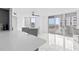 Bright living room showcasing sleek marble floors, modern gray furniture, and stunning ocean views at 3047 S Atlantic Ave # 1805, Daytona Beach, FL 32118