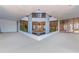 Inviting lobby with floor-to-ceiling windows and a unique rock fountain feature at 3047 S Atlantic Ave # 1805, Daytona Beach, FL 32118