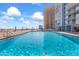 Rooftop pool with clear blue water and views of the buildings at 3047 S Atlantic Ave # 1805, Daytona Beach, FL 32118