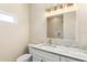 Modern bathroom features a vanity with stone countertop, sink and mirror at 349 Baker Ave, Lake Helen, FL 32744