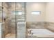 Luxurious bathroom with glass shower and soaking tub at 349 Baker Ave, Lake Helen, FL 32744