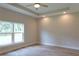 Bright, open bedroom with a ceiling fan and large windows at 349 Baker Ave, Lake Helen, FL 32744
