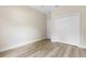 Bedroom with wood look flooring, a closet and neutral colored walls at 349 Baker Ave, Lake Helen, FL 32744