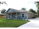Charming, newly built single-Gathering home featuring a covered front porch, and attached two car garage at 349 Baker Ave, Lake Helen, FL 32744