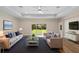 Spacious living room with ample seating, lots of natural light, and a modern rug at 349 Baker Ave, Lake Helen, FL 32744