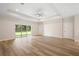 Bright living room features an oversized sliding door to the backyard at 349 Baker Ave, Lake Helen, FL 32744