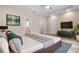 Comfortable main bedroom with TV, ensuite, and neutral colors at 349 Baker Ave, Lake Helen, FL 32744
