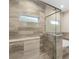 Modern bathroom with tile shower and built-in shower bench at 349 Baker Ave, Lake Helen, FL 32744