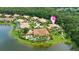 Overhead shot of estate homes showcases the beautiful landscaping, private pools, and lake views, offering an upscale lifestyle at 3592 Grande Tuscany Way, New Smyrna Beach, FL 32168