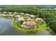 Aerial view of multiple homes with private pools on a waterfront community showcasing a serene and upscale neighborhood at 3592 Grande Tuscany Way, New Smyrna Beach, FL 32168