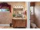 Charming bathroom with a custom vanity, decorative mirror, and elegant fixtures at 3592 Grande Tuscany Way, New Smyrna Beach, FL 32168