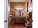 An elegant bathroom features warm wall color, framed art and vanity with a decorative vase at 3592 Grande Tuscany Way, New Smyrna Beach, FL 32168