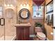 Stylish bathroom featuring a tiled shower, custom vanity, and elegant finishes at 3592 Grande Tuscany Way, New Smyrna Beach, FL 32168