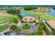 Beautiful view of the clubhouse located on golf course and pristine landscaping showcasing a high-end community setting at 3592 Grande Tuscany Way, New Smyrna Beach, FL 32168