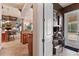 Inviting foyer leading to a stylish living area featuring tile floors and natural light at 3592 Grande Tuscany Way, New Smyrna Beach, FL 32168