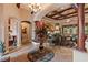 Elegant foyer featuring a decorative table with floral arrangement and a coffered ceiling design at 3592 Grande Tuscany Way, New Smyrna Beach, FL 32168