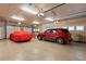 A spacious garage offers multiple parking spaces, storage cabinets, and natural light at 3592 Grande Tuscany Way, New Smyrna Beach, FL 32168