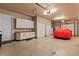 The garage is equipped with white cabinets, counter space, and has room for car storage at 3592 Grande Tuscany Way, New Smyrna Beach, FL 32168
