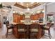 Gourmet kitchen featuring granite countertops, custom cabinetry, and modern stainless steel appliances at 3592 Grande Tuscany Way, New Smyrna Beach, FL 32168