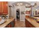Gourmet kitchen featuring granite counters, tile floors, and walk-in pantry for ample storage and easy access at 3592 Grande Tuscany Way, New Smyrna Beach, FL 32168