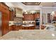 Well-equipped kitchen with granite countertops, custom cabinetry, and stainless steel appliances at 3592 Grande Tuscany Way, New Smyrna Beach, FL 32168