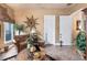 Cozy living room area with plenty of seating, decor, and natural lighting at 3592 Grande Tuscany Way, New Smyrna Beach, FL 32168