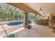 Relaxing screened-in patio with a beautiful pool and spa at 3592 Grande Tuscany Way, New Smyrna Beach, FL 32168