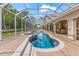 This in-ground pool is surrounded by a screened enclosure at 3592 Grande Tuscany Way, New Smyrna Beach, FL 32168