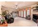 Spacious recreation room with exercise equipment, TV, and natural light at 3592 Grande Tuscany Way, New Smyrna Beach, FL 32168