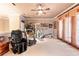 Bright recreation room featuring exercise equipment and a comfortable seating area at 3592 Grande Tuscany Way, New Smyrna Beach, FL 32168