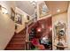 Ornate staircase featuring detailed woodwork, custom lighting, and unique decor at 3592 Grande Tuscany Way, New Smyrna Beach, FL 32168