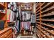 Spacious walk-in closet with custom shelving and ample storage for clothes, shoes, and accessories at 3592 Grande Tuscany Way, New Smyrna Beach, FL 32168