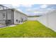 Manicured backyard with lush green grass and privacy fence, ideal for outdoor activities at 413 Last Tree Dr, Deland, FL 32720
