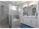 Bright bathroom featuring a walk-in shower, soaking tub, double vanity, and modern fixtures at 413 Last Tree Dr, Deland, FL 32720