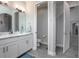 Well-lit bathroom featuring a double vanity, separate toilet room, and modern finishes at 413 Last Tree Dr, Deland, FL 32720