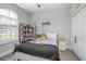 Bright bedroom with neutral colors, a ceiling fan, plantation shutters, and a comfortable bed at 413 Last Tree Dr, Deland, FL 32720
