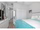 Bright bedroom with neutral colors, a ceiling fan, plantation shutters, and a comfortable bed at 413 Last Tree Dr, Deland, FL 32720