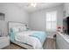 Bright bedroom with neutral colors, a ceiling fan, plantation shutters, and a comfortable bed at 413 Last Tree Dr, Deland, FL 32720