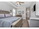 Comfortable main bedroom with stylish decor, tray ceiling, and wood floors at 413 Last Tree Dr, Deland, FL 32720
