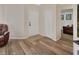 Bright entry way featuring a wood-look floor, with a view to the adjacent living space at 414 Lancaster Ave, Orange City, FL 32763