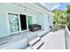 Inviting back porch with comfortable seating and peaceful outdoor views at 417 S Palmetto Ave, Daytona Beach, FL 32114