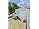 Backyard with a pool, deck, and staircase to upper level at 417 S Palmetto Ave, Daytona Beach, FL 32114