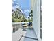 Private balcony with comfortable seating and a small table, perfect for relaxing outdoors at 417 S Palmetto Ave, Daytona Beach, FL 32114