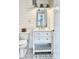 Modern bathroom featuring a white vanity with storage, patterned tile floors, and shiplap walls at 417 S Palmetto Ave, Daytona Beach, FL 32114