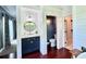 Bathroom featuring shiplap walls, stylish vanity, toilet and soaking tub at 417 S Palmetto Ave, Daytona Beach, FL 32114