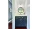 Charming powder room featuring shiplap walls and a stylish vanity at 417 S Palmetto Ave, Daytona Beach, FL 32114