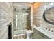 Stylish bathroom featuring a glass-enclosed shower and wood-look tiled walls at 417 S Palmetto Ave, Daytona Beach, FL 32114