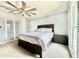 Serene bedroom with neutral tones, ceiling fan, and ample natural light at 417 S Palmetto Ave, Daytona Beach, FL 32114