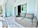 Comfortable deck with an outdoor sofa and sliding door at 417 S Palmetto Ave, Daytona Beach, FL 32114